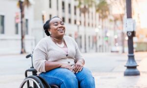 smiling woman in wheelchair