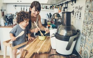 mom and son cooking together in kitchen