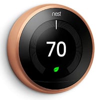 copper nest thermostat with digital display of 70 deg. and green light