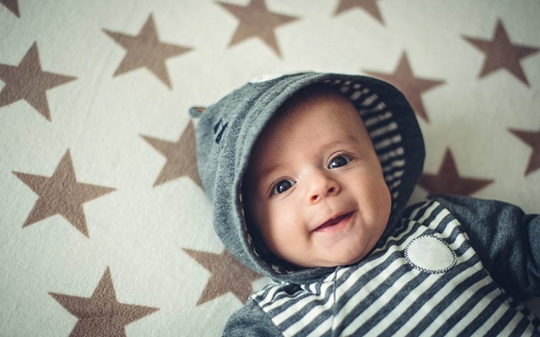 Baby laying in crib